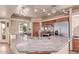Bright kitchen with granite countertops, stainless steel appliances, wooden cabinets, and tile flooring at 1954 N Calle Maderas --, Mesa, AZ 85213