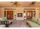 Inviting patio features a fireplace, ceiling fans, and comfortable seating for relaxation and enjoyment at 1954 N Calle Maderas --, Mesa, AZ 85213