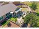 An aerial view shows an outdoor kitchen, a putting green, a covered patio, and manicured landscaping at 20426 N Blazing Sun Rd, Maricopa, AZ 85138