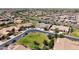 Aerial view showcases a suburban neighborhood with well-maintained streets and landscaping at 20426 N Blazing Sun Rd, Maricopa, AZ 85138