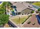 Aerial view of home showcasing a well-manicured lawn, mini golf, and outdoor living space at 20426 N Blazing Sun Rd, Maricopa, AZ 85138