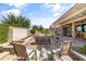 Outdoor patio area with water feature, seating, and shade cover, perfect for relaxation at 20426 N Blazing Sun Rd, Maricopa, AZ 85138