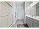Bathroom with a walk-in shower, sleek vanity, and modern fixtures at 20426 N Blazing Sun Rd, Maricopa, AZ 85138