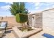 Outdoor space featuring a tranquil water feature with a waterfall and lush greenery at 20426 N Blazing Sun Rd, Maricopa, AZ 85138