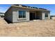 New home construction highlighting large sliding glass doors and bright windows at the rear at 22709 E Saddle Way, Queen Creek, AZ 85142