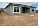 New home backyard featuring a covered patio and an expansive yard, perfect for outdoor activities at 22709 E Saddle Way, Queen Creek, AZ 85142