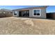 Expansive backyard, perfect for outdoor living, with a covered patio and ample space for entertaining at 22709 E Saddle Way, Queen Creek, AZ 85142