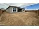 Large backyard space with privacy block wall, ideal for creating your dream outdoor living area at 22709 E Saddle Way, Queen Creek, AZ 85142
