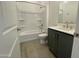Well-lit bathroom featuring shower and tub combo with modern vanity at 22709 E Saddle Way, Queen Creek, AZ 85142