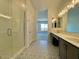 Bathroom with patterned tile floor, glass shower, and double sink vanity at 22709 E Saddle Way, Queen Creek, AZ 85142