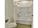 Clean bathroom with white shower-tub combination and neutral tile at 22709 E Saddle Way, Queen Creek, AZ 85142