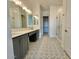 Bathroom showcases patterned tile flooring, dual sinks, and a glass-enclosed shower at 22709 E Saddle Way, Queen Creek, AZ 85142