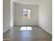 This bedroom features stylish tile flooring and a bright window, enhancing its spacious and airy feel at 22709 E Saddle Way, Queen Creek, AZ 85142