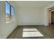This bright bedroom features tiled flooring and a large window, offering a refreshing and open feel at 22709 E Saddle Way, Queen Creek, AZ 85142