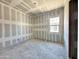 Bedroom view of new construction with drywall and framing for a window and doorway at 22709 E Saddle Way, Queen Creek, AZ 85142