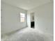 Unfinished room with one window and a view of a bathroom at 22709 E Saddle Way, Queen Creek, AZ 85142