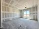 Unfinished bedroom featuring drywall and a large window offering natural light at 22709 E Saddle Way, Queen Creek, AZ 85142