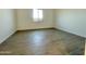 The bright bedroom showcases tile flooring and a large window, ensuring a well-lit and airy atmosphere at 22709 E Saddle Way, Queen Creek, AZ 85142