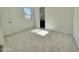 Sunlit bedroom with plush carpeting and a view to an ensuite bathroom at 22709 E Saddle Way, Queen Creek, AZ 85142
