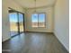 Dining room features a modern chandelier and a sliding glass door to the backyard at 22709 E Saddle Way, Queen Creek, AZ 85142