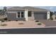 Beautiful single-Gathering home featuring desert landscaping and a two car garage at 22709 E Saddle Way, Queen Creek, AZ 85142
