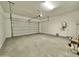 Spacious two car garage with an automatic door, water heater, and storage space at 22709 E Saddle Way, Queen Creek, AZ 85142