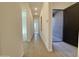 Bright hallway with recessed lighting and tile flooring connects various rooms at 22709 E Saddle Way, Queen Creek, AZ 85142