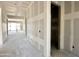 Hallway of a new construction home with drywall and framing for the ceiling at 22709 E Saddle Way, Queen Creek, AZ 85142