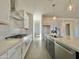 This kitchen features a large island, stainless appliances, and bright white cabinets at 22709 E Saddle Way, Queen Creek, AZ 85142