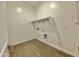 This well-lit laundry room boasts sleek tile floors and ample space for appliances, making chores a breeze at 22709 E Saddle Way, Queen Creek, AZ 85142
