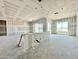 Living room view of new construction with drywall, framing, large windows, and a bar at 22709 E Saddle Way, Queen Creek, AZ 85142