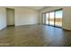 Spacious living room with tile floors and sliding glass doors to the backyard at 22709 E Saddle Way, Queen Creek, AZ 85142