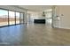 Open-concept living space features tile flooring, recessed lighting, and backyard access at 22709 E Saddle Way, Queen Creek, AZ 85142