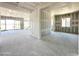 Living room view of new construction with drywall, framing, and sliding glass door at 22709 E Saddle Way, Queen Creek, AZ 85142