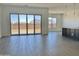 The spacious living room offers tile flooring, and large sliding glass doors providing a seamless indoor-outdoor living experience at 22709 E Saddle Way, Queen Creek, AZ 85142