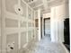 Unfinished room featuring drywall and pass-through to another space at 22709 E Saddle Way, Queen Creek, AZ 85142