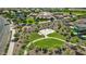 Aerial view shows a basketball court and green space nestled among the homes and greenery of the community at 2496 E Lindrick Dr, Gilbert, AZ 85298