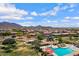 Aerial view of community park with playground, pool and ramadas amid lush desert landscaping at 2496 E Lindrick Dr, Gilbert, AZ 85298