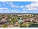 Community aerial showcasing pool, playground, green spaces, ramada and residential area at 2496 E Lindrick Dr, Gilbert, AZ 85298