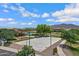 Aerial view of the community basketball court, pool, park and nearby neighborhood at 2496 E Lindrick Dr, Gilbert, AZ 85298