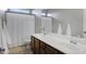 Bathroom featuring double sinks, granite counters, and a shower at 2496 E Lindrick Dr, Gilbert, AZ 85298