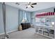 Bedroom with blue walls, plush carpet, a bunk bed, a window, and dresser at 2496 E Lindrick Dr, Gilbert, AZ 85298