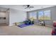 Spacious bonus room featuring large windows for plenty of natural light at 2496 E Lindrick Dr, Gilbert, AZ 85298