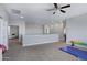 Open bonus room with neutral walls, carpet, and access to multiple rooms at 2496 E Lindrick Dr, Gilbert, AZ 85298