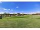 Scenic view of community park with playground, ramada, and lush landscaping at 2496 E Lindrick Dr, Gilbert, AZ 85298