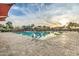 Community pool with a view of a splash pad and playground at 2496 E Lindrick Dr, Gilbert, AZ 85298
