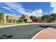 Attractive exterior view of the community center showing desert landscaping, stone accents, and ample parking at 2496 E Lindrick Dr, Gilbert, AZ 85298