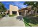 Modern community building featuring textured exterior, manicured landscaping and plentiful light from large windows at 2496 E Lindrick Dr, Gilbert, AZ 85298