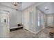 Well-lit home entry with decorative bench and neutral paint creating a bright, welcoming space at 2496 E Lindrick Dr, Gilbert, AZ 85298