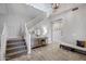 Bright foyer showcasing a staircase, console table with décor, and an open, airy ambiance at 2496 E Lindrick Dr, Gilbert, AZ 85298